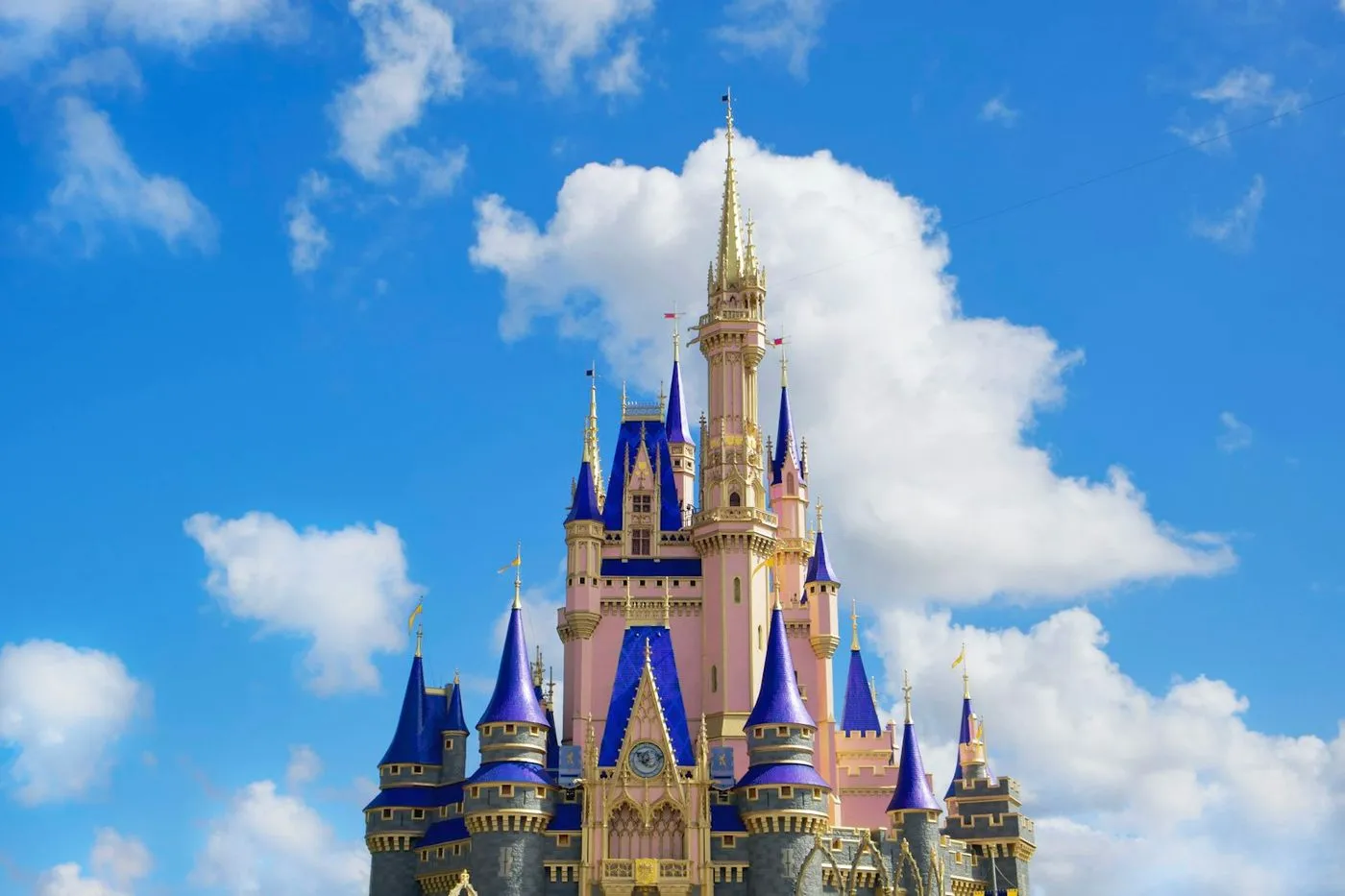 Cinderella Castle at Magic Kingdom under a bright blue sky