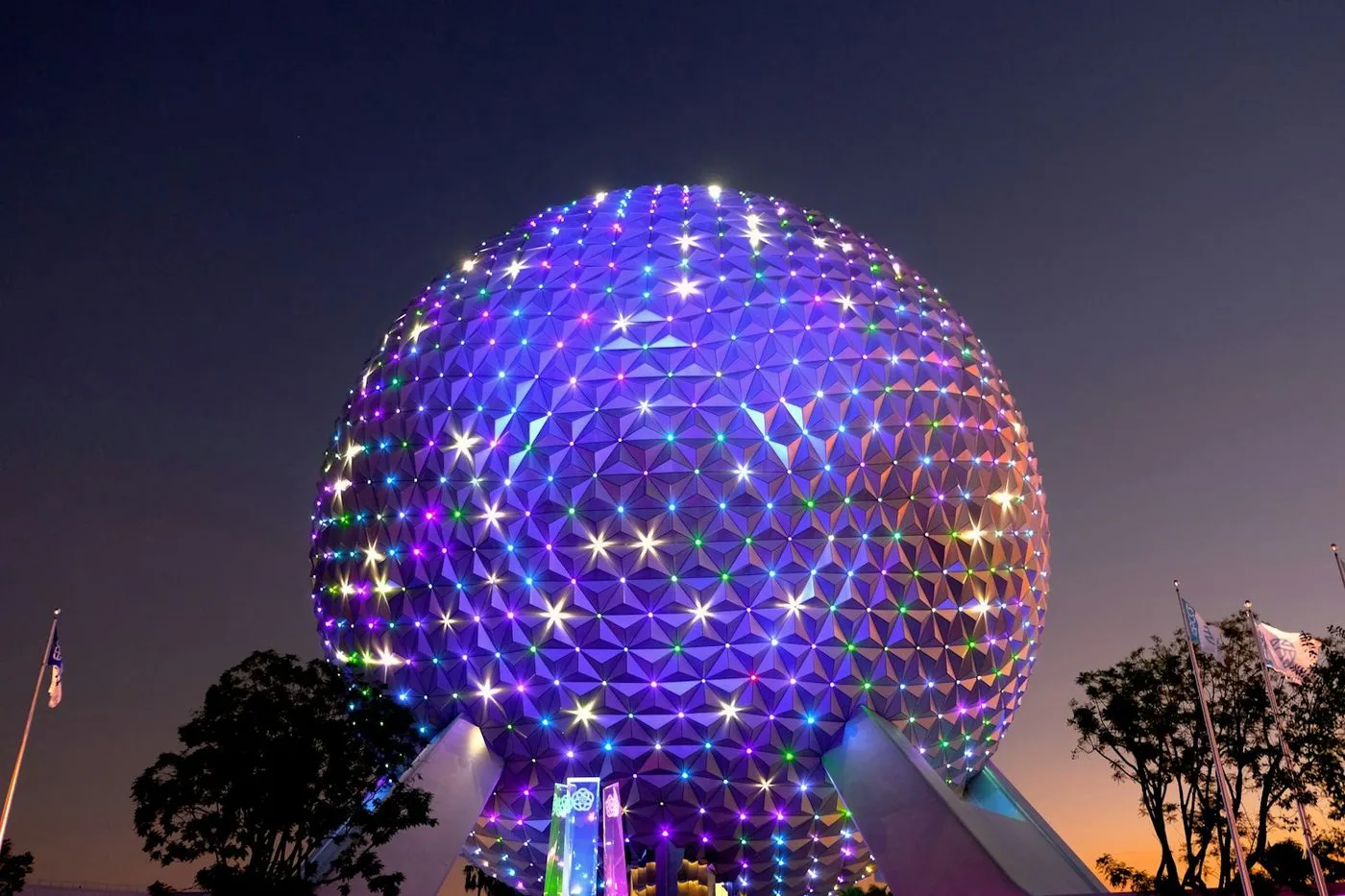Spaceship Earth lit up at night at EPCOT