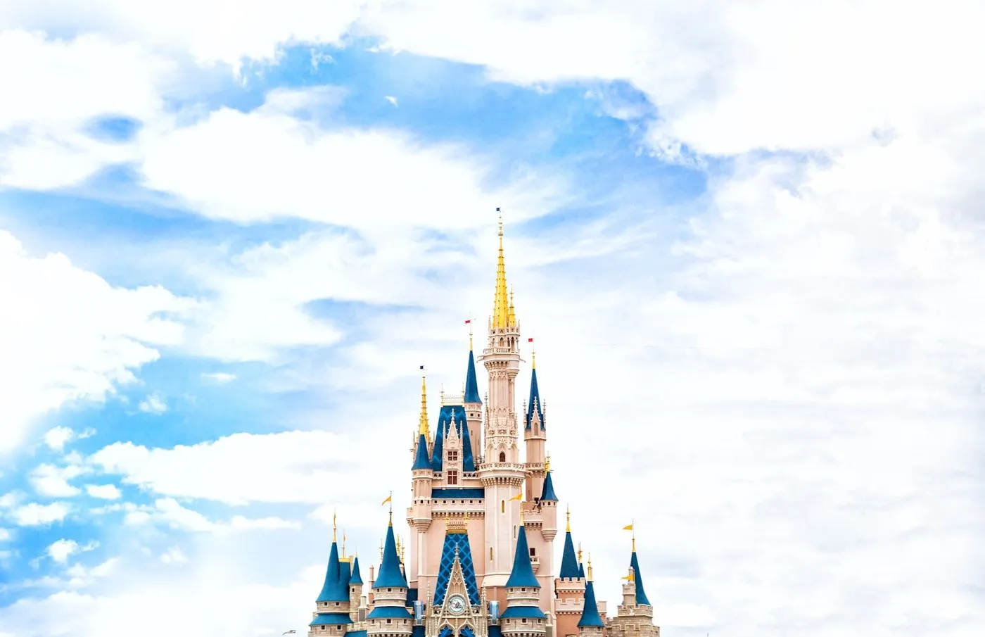 Cinderella Castle at Magic Kingdom against a bright blue sky